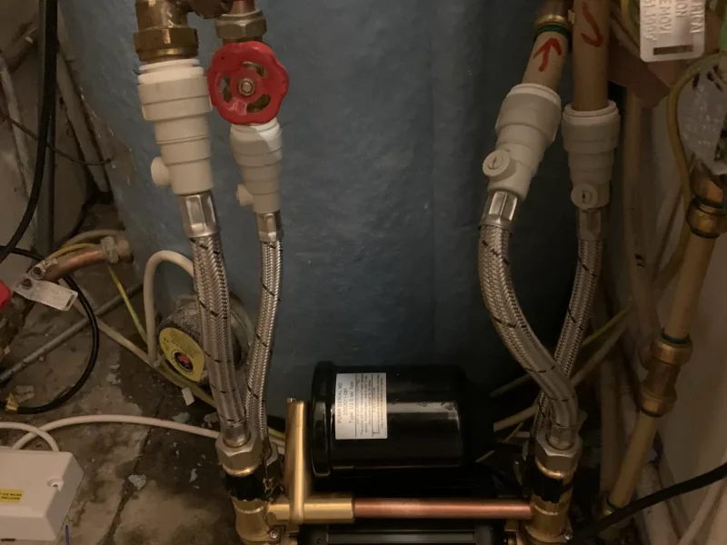 Shower pump keeps running in Dublin home hot press installation with cylinder and pipework